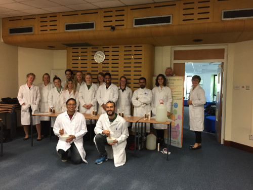 Outreach Team group photo in lab coats